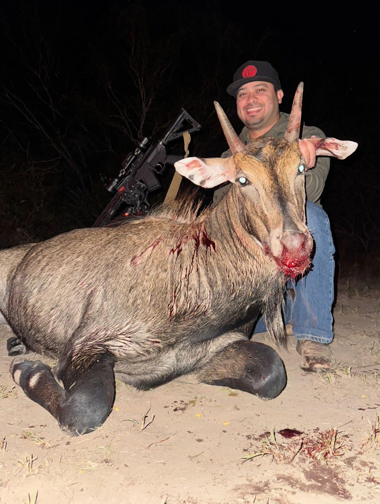Hunter with a harvested nilgai